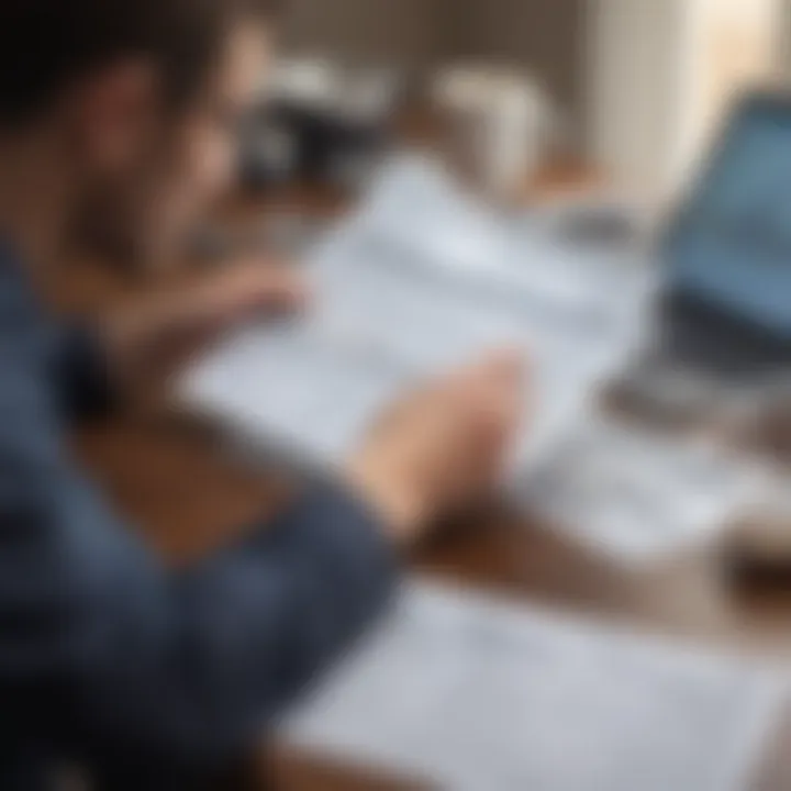 Person reviewing financial documents at a desk